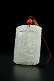 A FINELY CARVED WHITE JADE PENDANT
