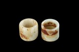 TWO JADE THUMB RINGS