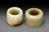TWO JADE THUMB RINGS