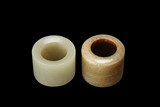 TWO JADE THUMB RINGS