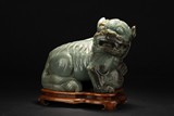 A LARGE JADE CARVED MYTHICAL BEAST