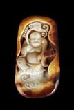 A CARVED JADE ARHAT ORNAMENT