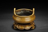 A BRONZE TRIPOD CENSER WITH STAND