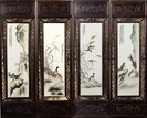 A SET OF FOUR HANGING PANELS WITH PORCELAIN PLATES