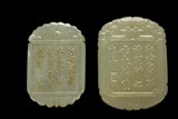 TWO CARVED JADE PENDANTS