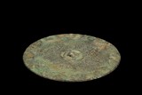 AN ARCHAIC BRONZE 'DRAGONS' MIRROR