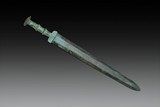 AN ARCHAIC BRONZE SWORD