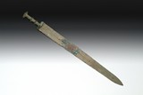 AN ARCHAIC BRONZE LONG SWORD