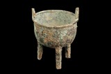 AN ARCHAIC BRONZE TRIPOD RITUAL FOOD VESSEL 'DING' 