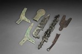 A GROUP OF ARCHAIC BRONZE WEAPONS AND COINS