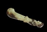 A JADE CARVING OF KNIFE ORNAMENT