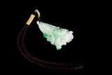 A CARVED JADEITE 'LETTUCE' PENDANT