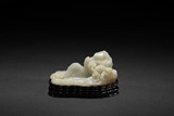 A WHITE JADE 'MOUNTAINS' WASHER