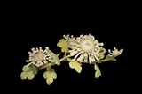 A CARVED IVORY 'CHRYSANTHEMUM' FIGURAL GROUP