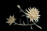 A CARVED IVORY 'CHRYSANTHEMUM' FIGURAL GROUP