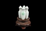 FOUR LINKED JADEITE SNUFF BOTTLES