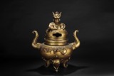 A LARGE GILT BRONZE TRIPOD CENSER