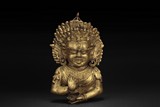 A GILT BRONZE BUDDHA FIGURE