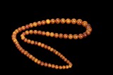 A STRAND OF ANTIQUE AMBER PRAYER BEADS