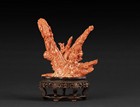 A CARVED CORAL 'GUANYIN AND DRAGON' FIGURAL GROUP