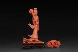 A CORAL CARVING OF BEAUTY AND A CORAL BROOCH