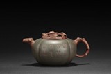 A GREEN CLAY 'PERSIMMON' TEAPOT