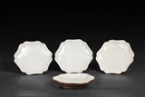 A SET OF FOUR ZISHA STONEWARE WITH GLAZE PLATES