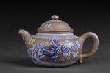 A PAINTED ZISHA STONEWARE TEAPOT