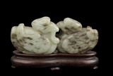 A CELADON JADE CARVING OF TWO MANDARIN DUCKS