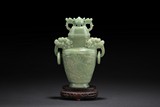 A CARVED JADE 'MYTHICAL BEAST' BOTTLE VASE