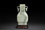 A CARVED WHITE JADE BOTTLE VASE WITH LOOPED HANDLES