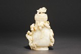 A WHITE JADE CARVED CHI-LONG VASE WITH COVER