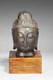 A STONE CARVING OF A BUDDHA'S HEAD
