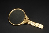 A GILT SILVER IVORY HANDLE HAND MIRROR