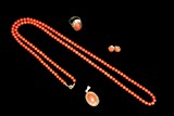 A SET OF RED CORAL JEWELRY WITH 14K GOLD SETTINGS