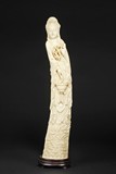 AN IVORY CARVING OF A STANDING GUANYIN