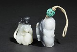 TWO BLACK AND WHITE JADE CARVED ORNAMENTS