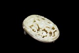 A WHITE JADE CARVED 'DRAGON' BELT BUCKLE WITH SILVER FRAME