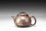 A YIXING GILT PAINTED TEAPOT