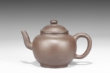 JING XI: A YIXING PURPLE CLAY TEAPOT