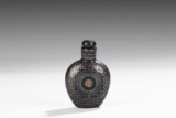 A MOTHER-OF-PEARL INLAID BLACK LACQUERED SNUFF BOTTLE