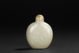 A CARVED WHITE JADE 'ORCHID' SNUFF BOTTLE