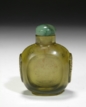 A CARVED GLASS SNUFF BOTTLE