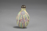 A CARVED PORCELAIN SNUFF BOTTLE
