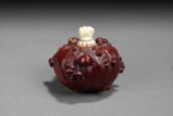 A CARVED GOURD SNUFF BOTTLE