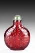 AN AMBER RUBY-RED GLASS 
