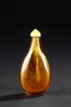 AN AMBER-BROWN GLASS SNUFF BOTTLE
