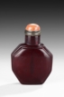 AN OCTAGONAL DARK RED GLASS SNUFF BOTTLE