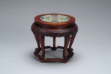 A HARDWOOD CIRCULAR STAND INSET WITH PORCELAIN