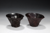 A PAIR OF CARVED ZITAN LIBATION CUPS